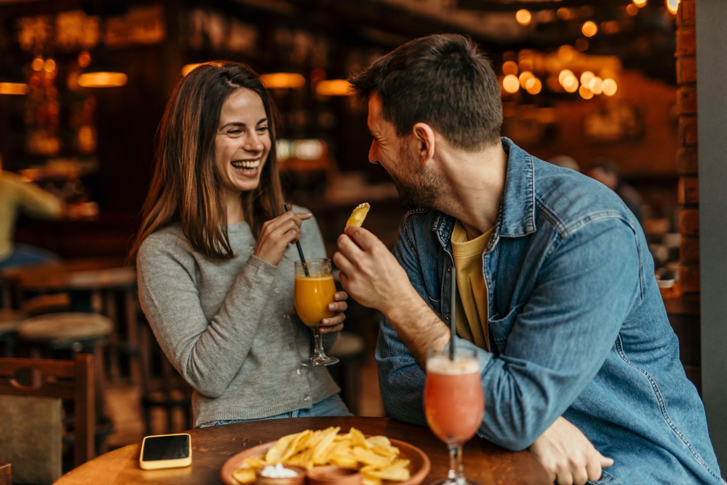 Couple having drinks and bites