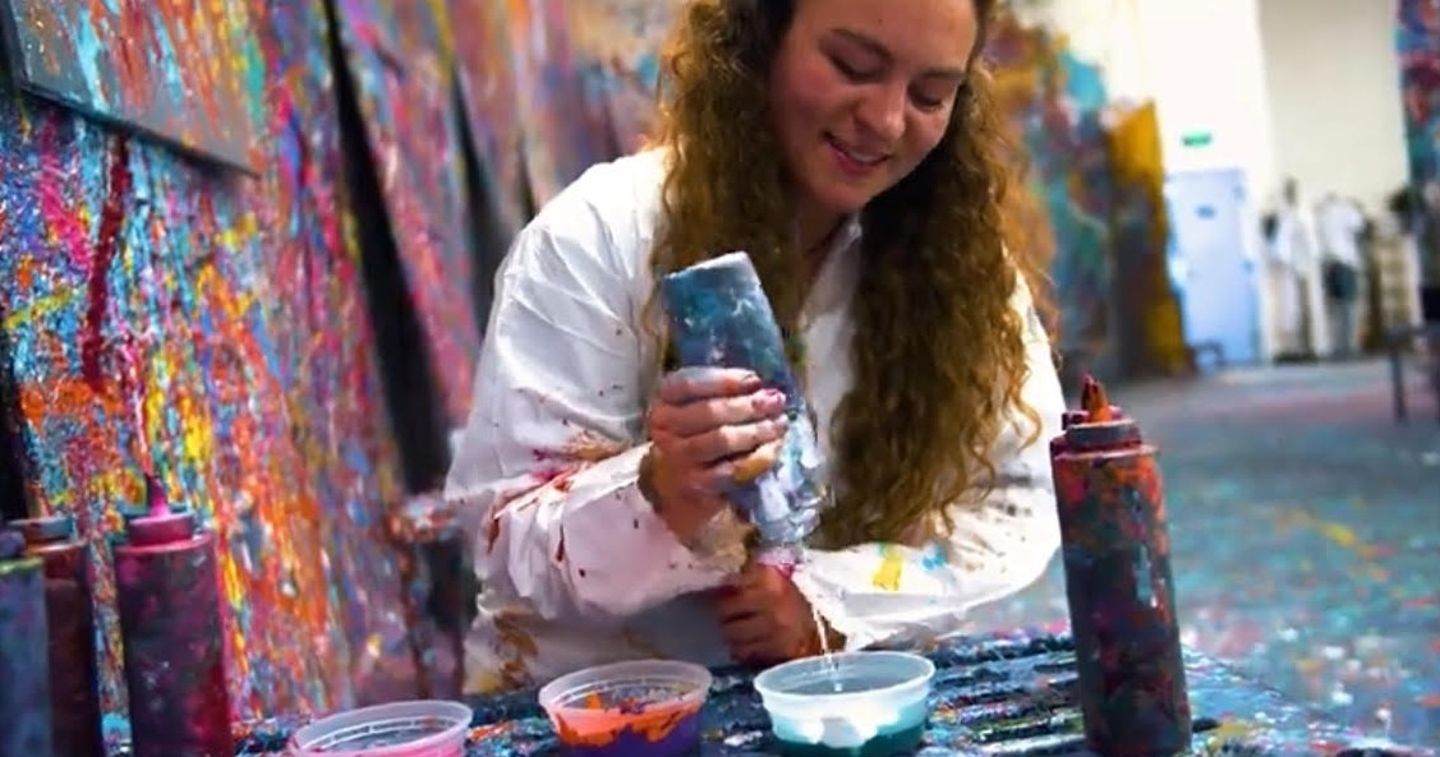 Woman pouring paint