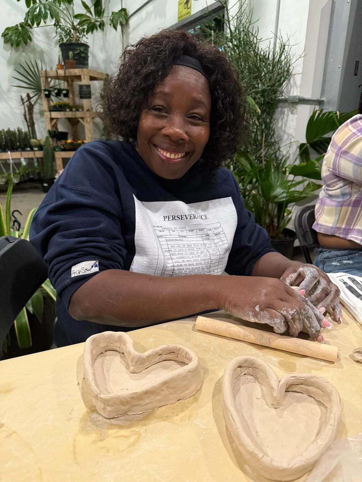 Woman with two pieces of pottery 