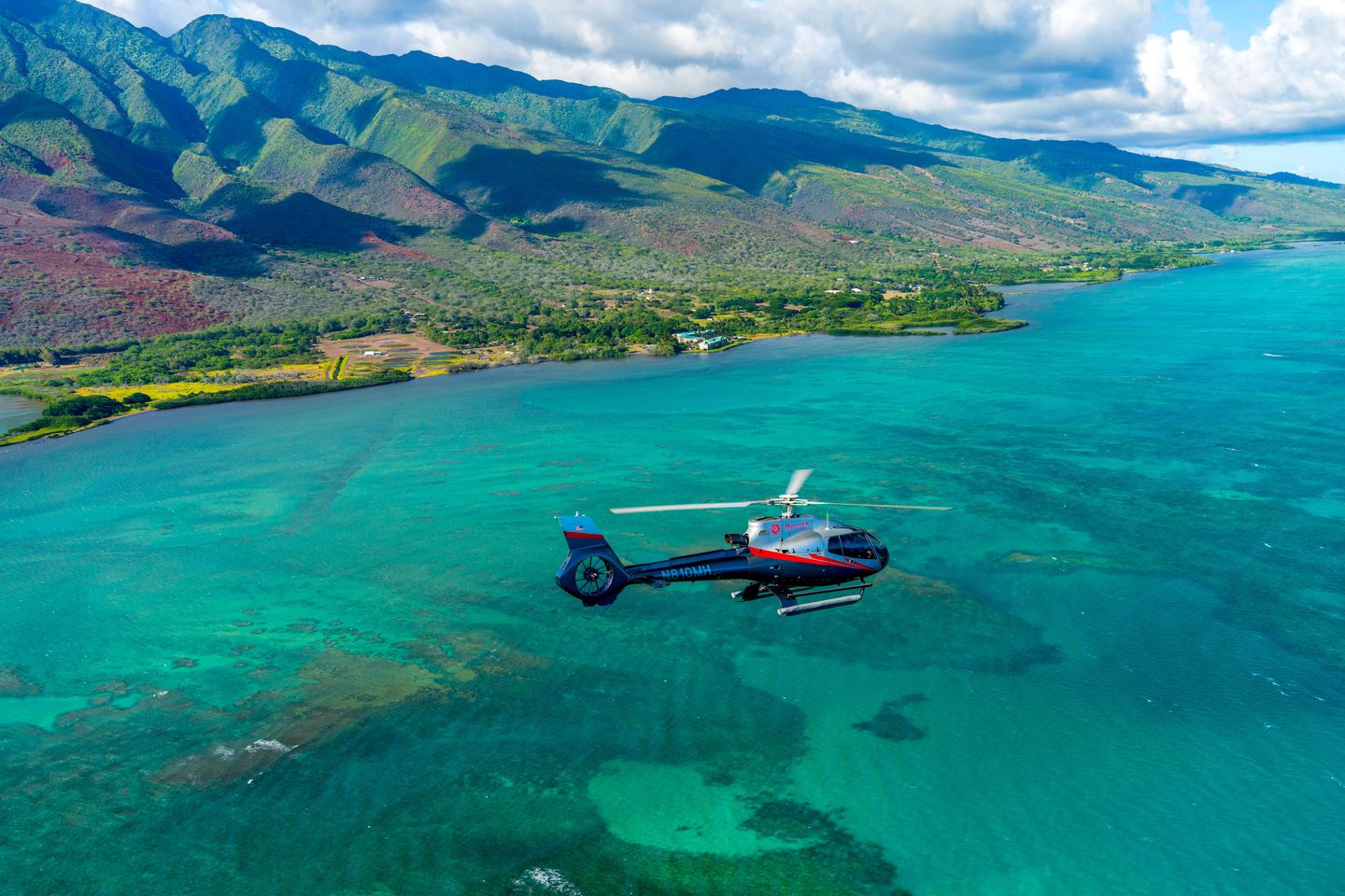 Helicopter flying over ocean