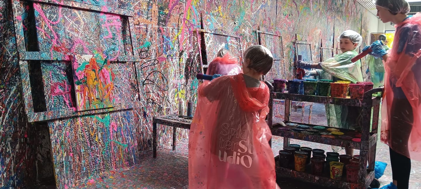 People splatter painting
