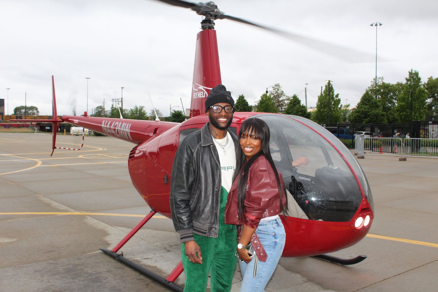 Couple next to helicopter