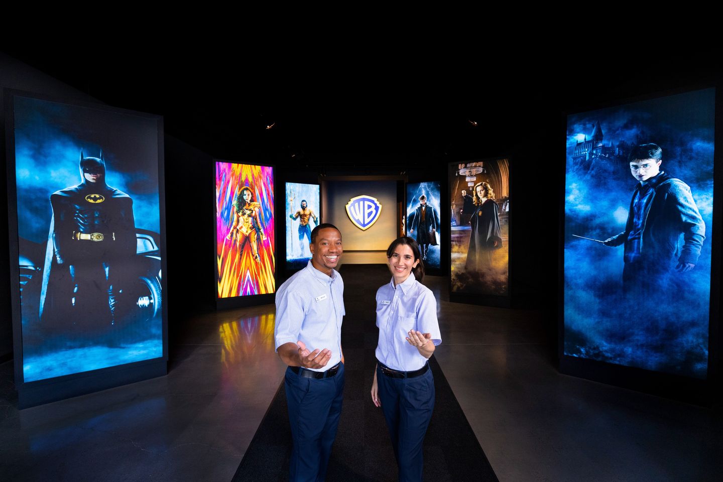 Two people with movie posters