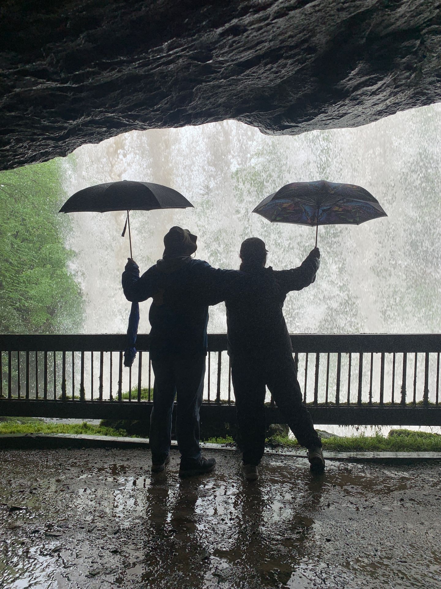 Couple holding ubrellas