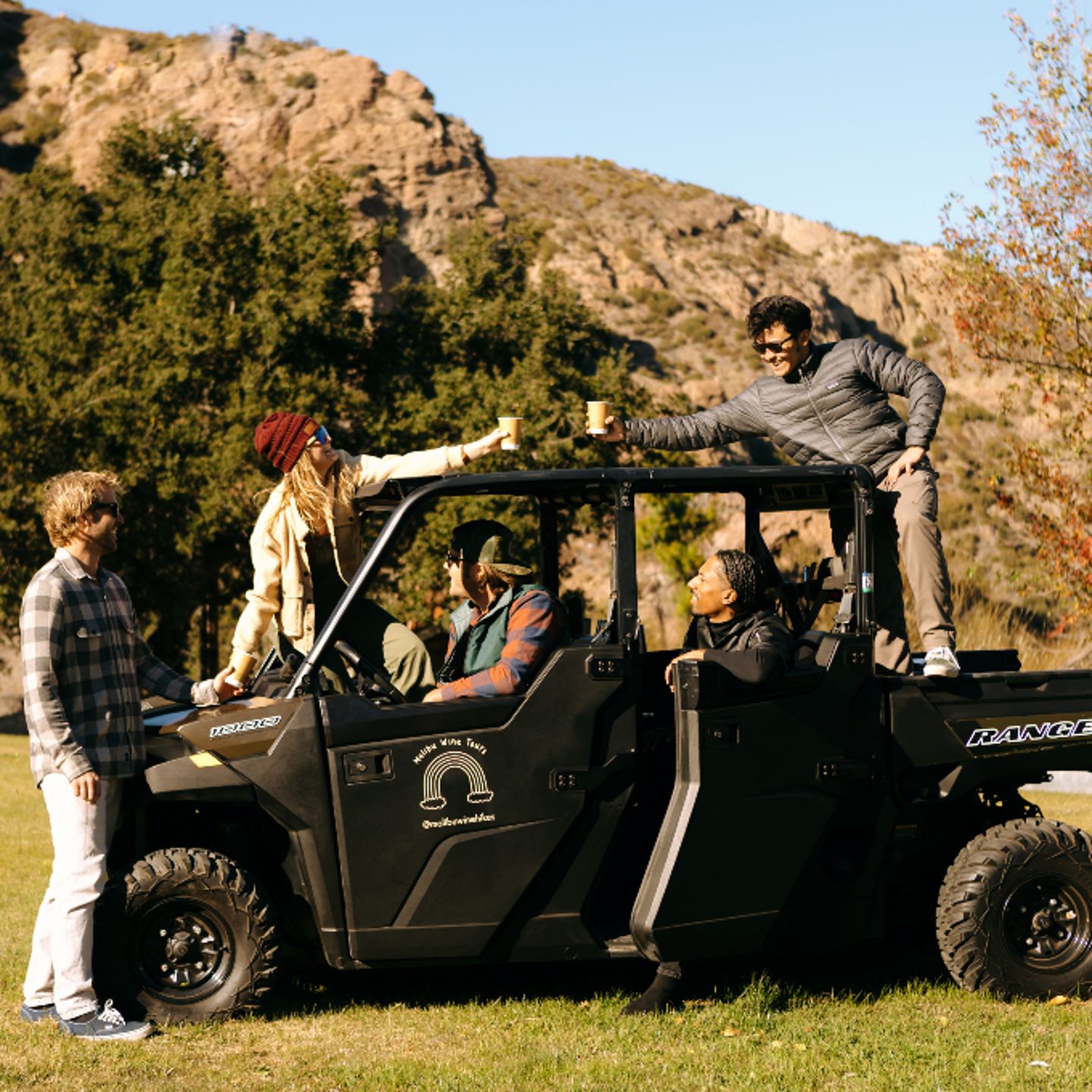 Group with drinks in 4x4