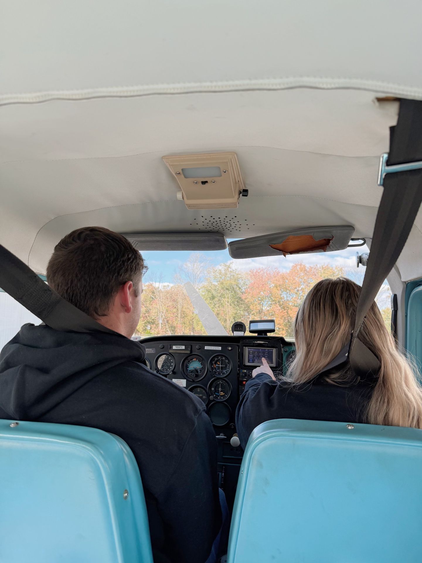 Two people flying plane