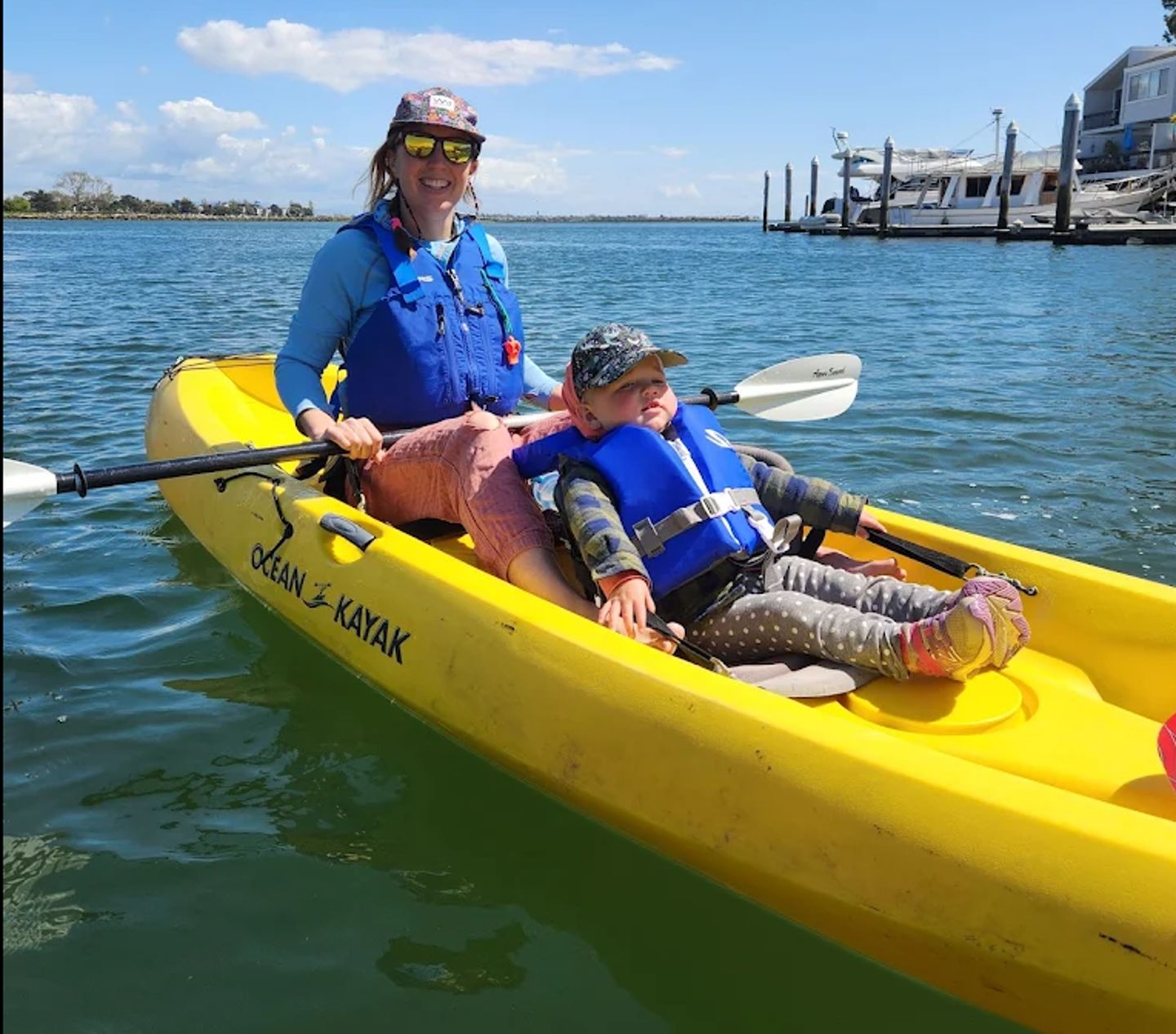 Woman on kayak with son