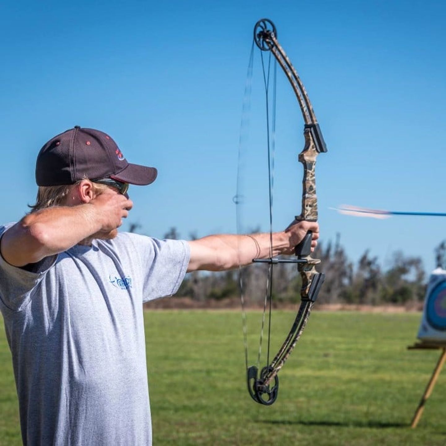 Man shooting bow and arrow