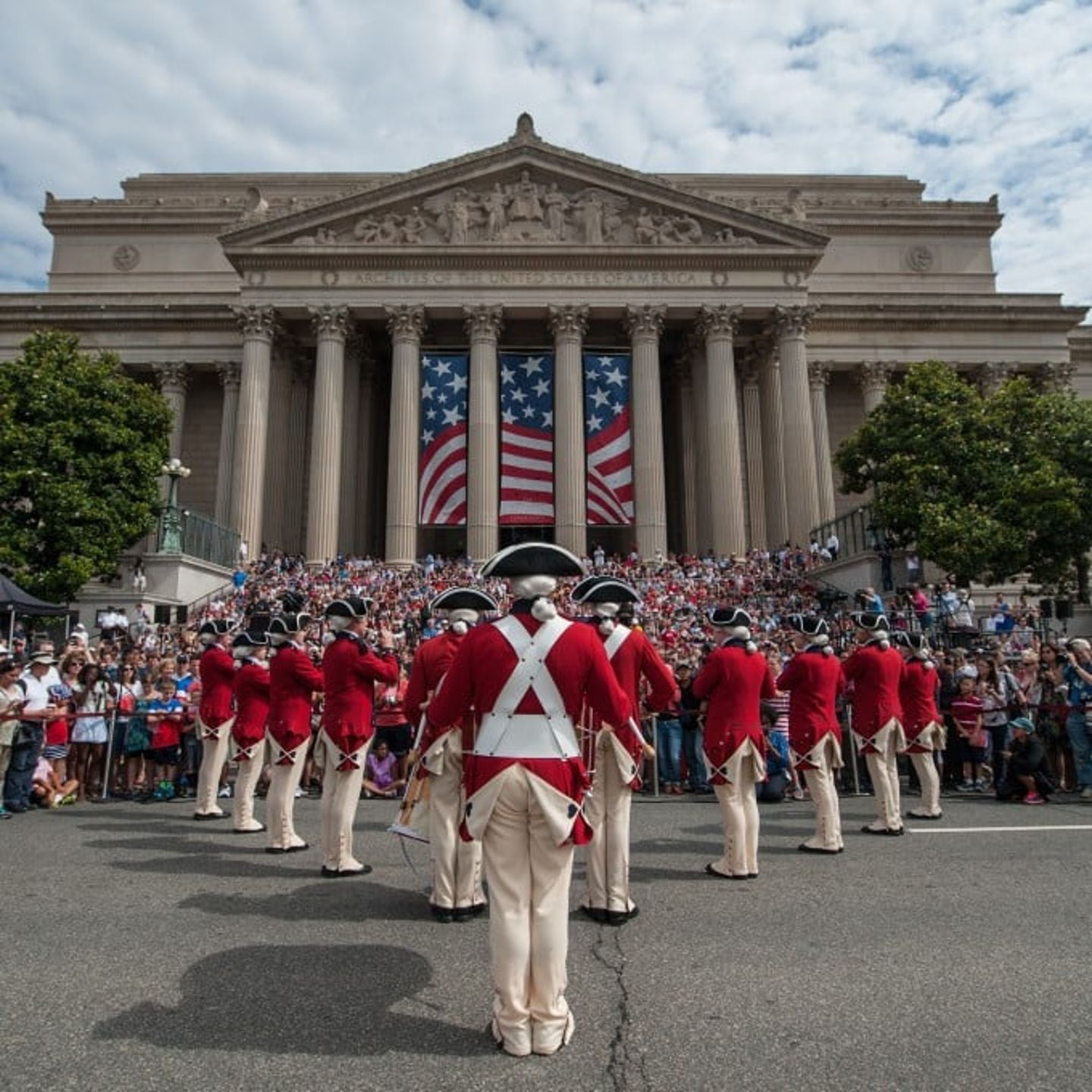 Patriots Lined up in Front of Building