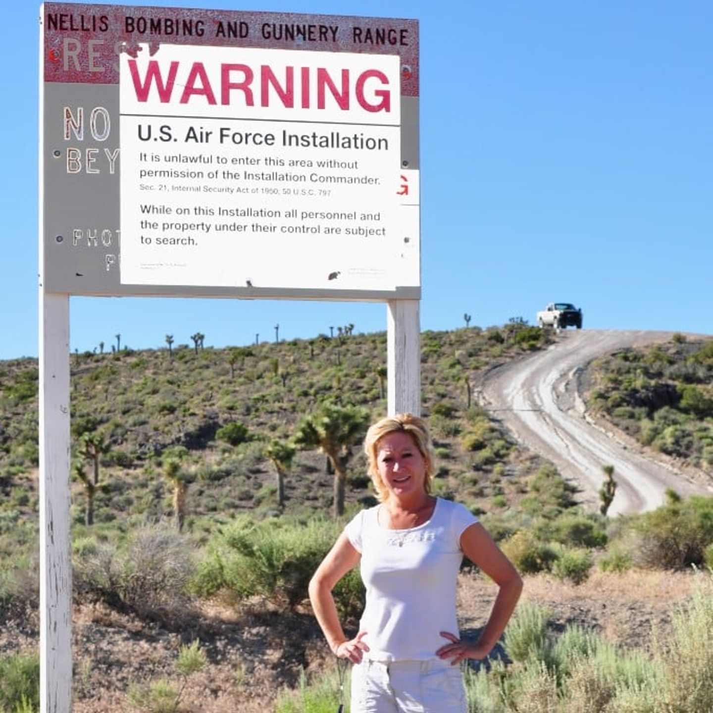 Woman in front of sign