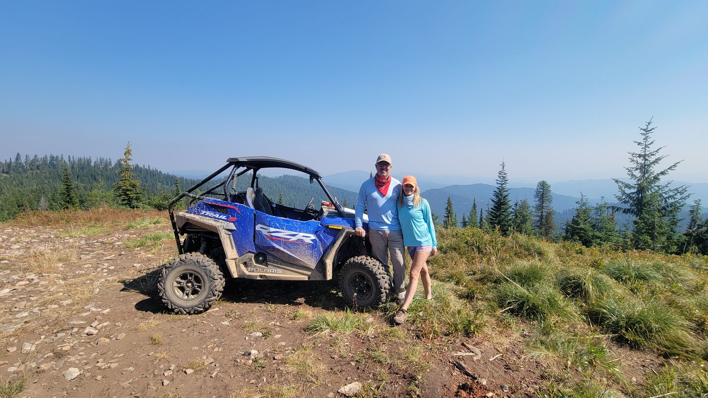 Couple next to ATV