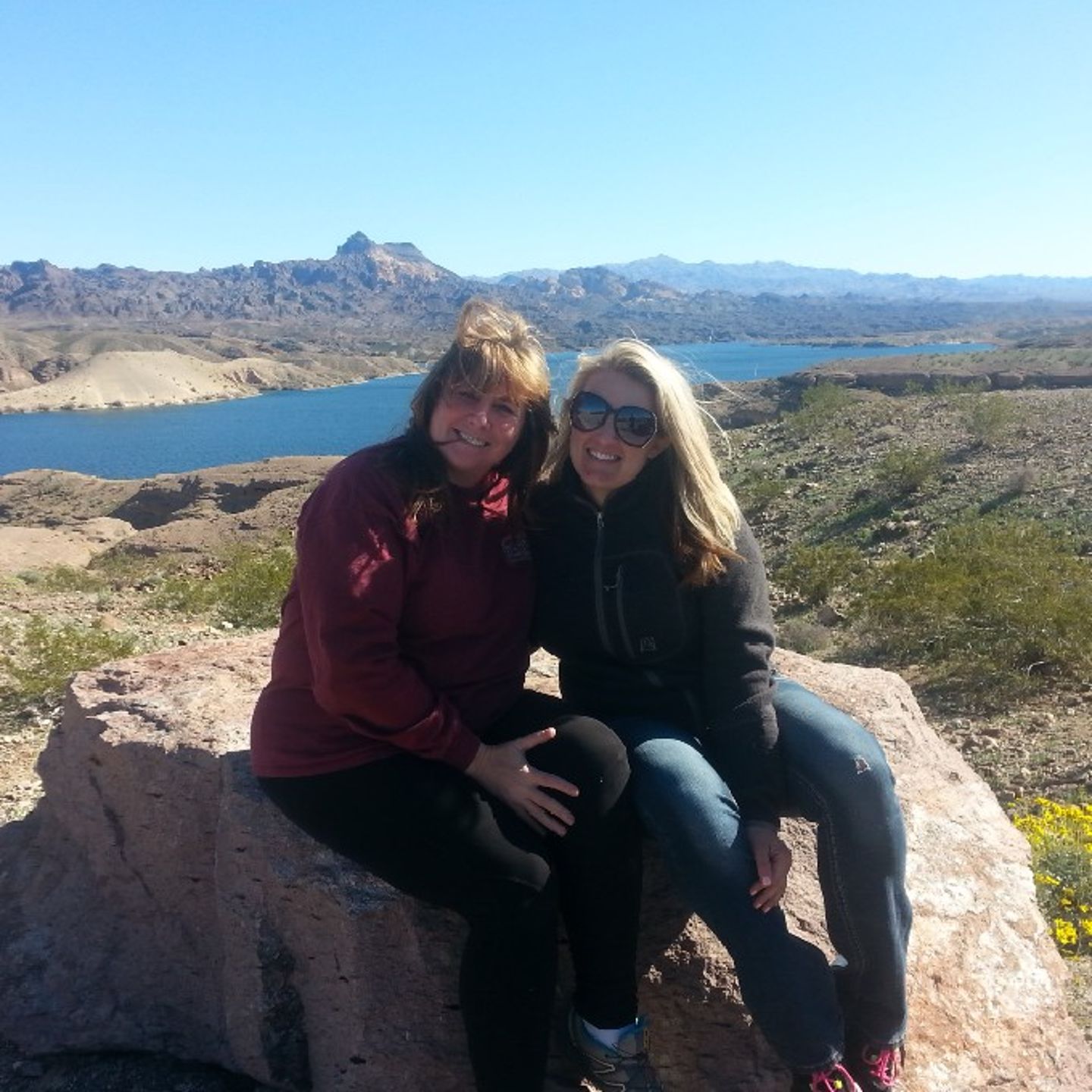 Group Sitting on Rock with View