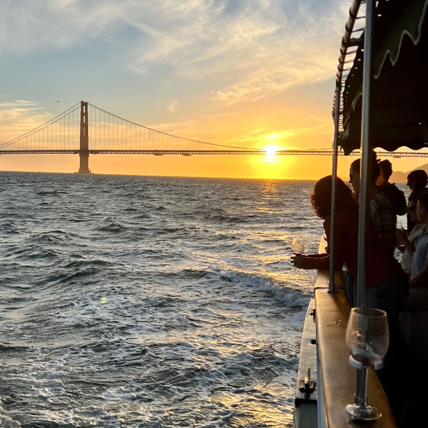Group on boat at sunset