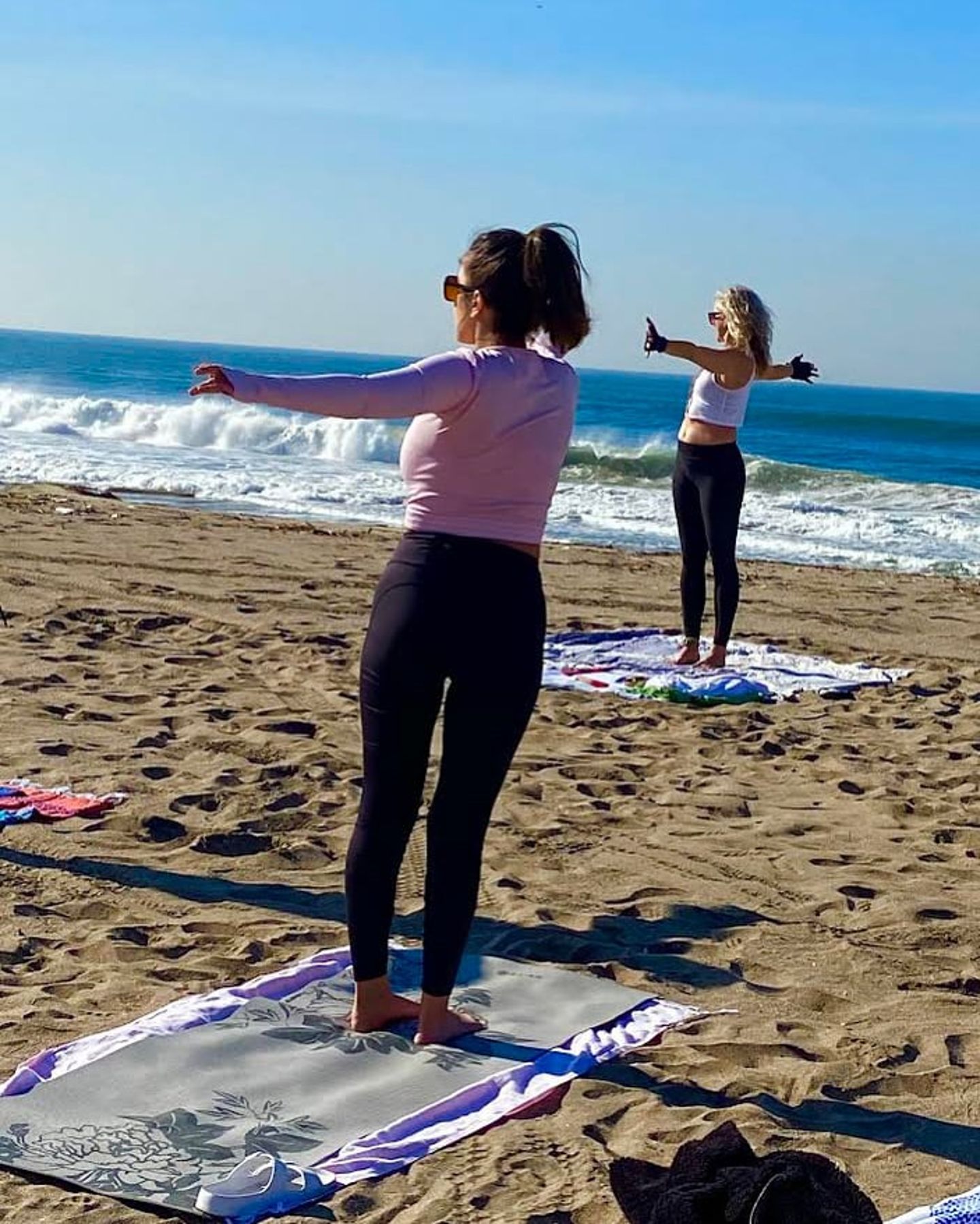 Two people doing yoga