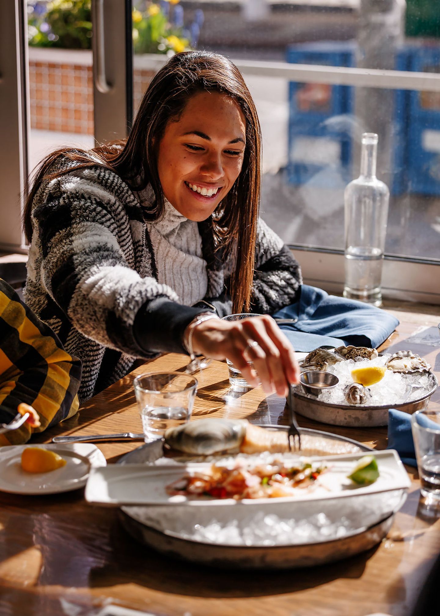 Woman eating oysters