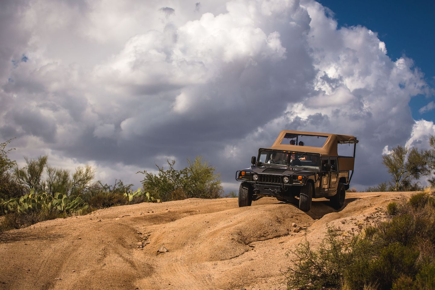 Hummer going up rock