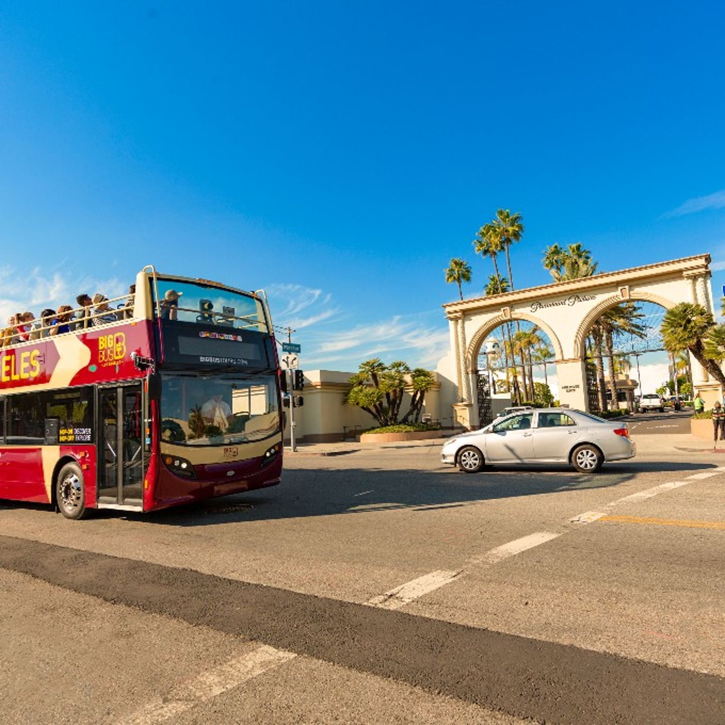 Bus driving past arch