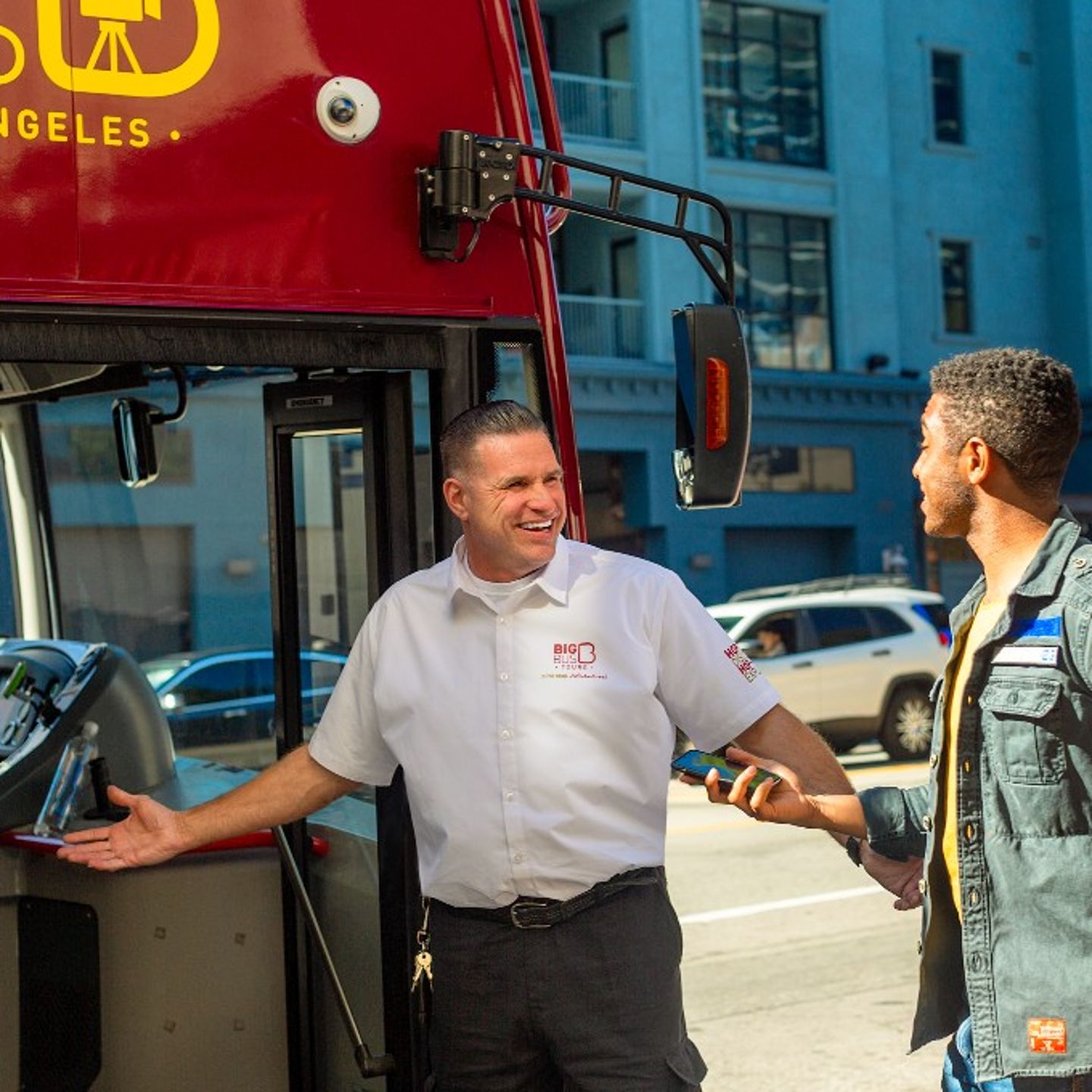Bus driver helping people on