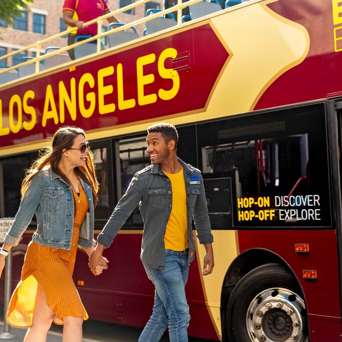 Couple getting on bus