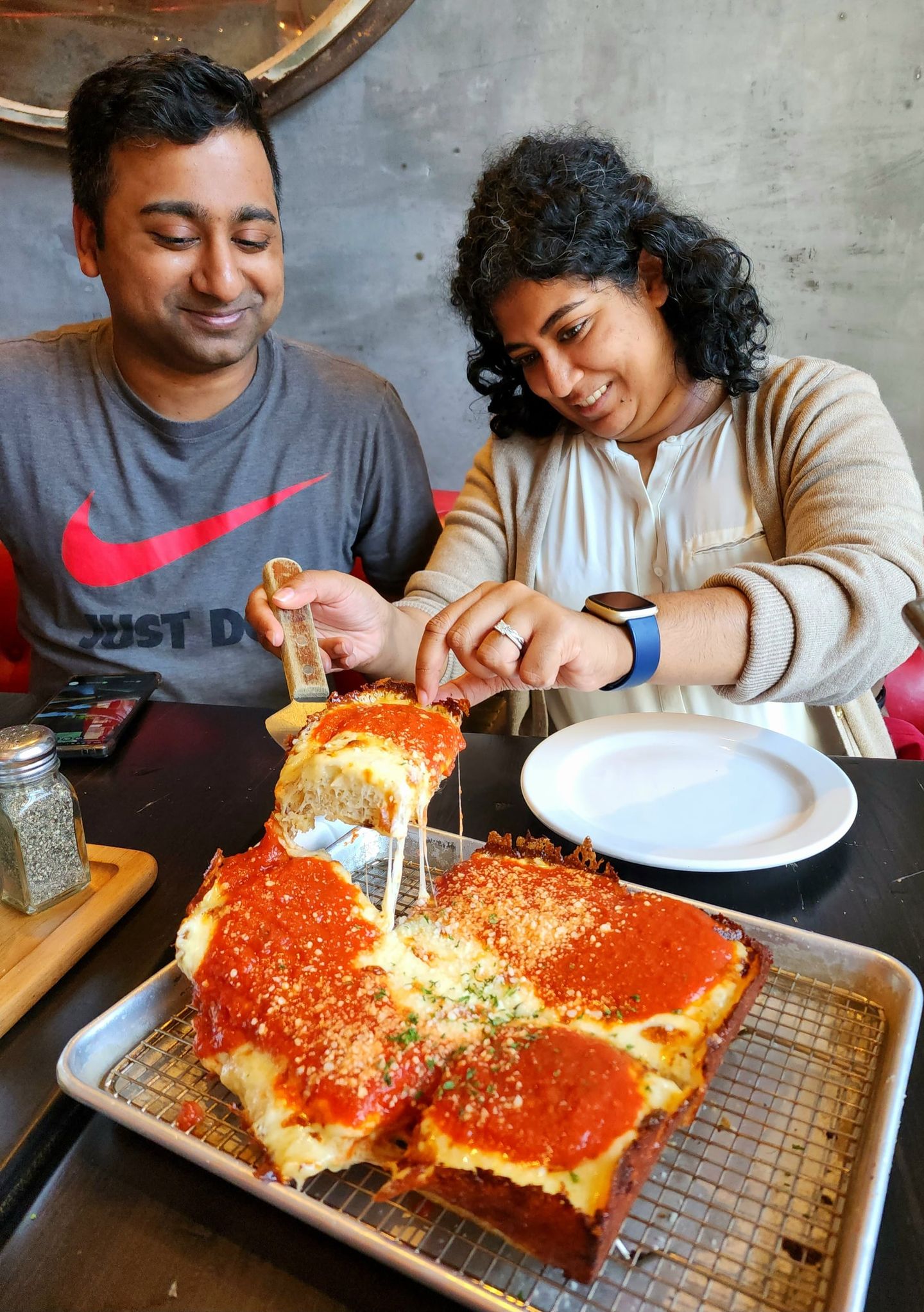 Couple eating pizza