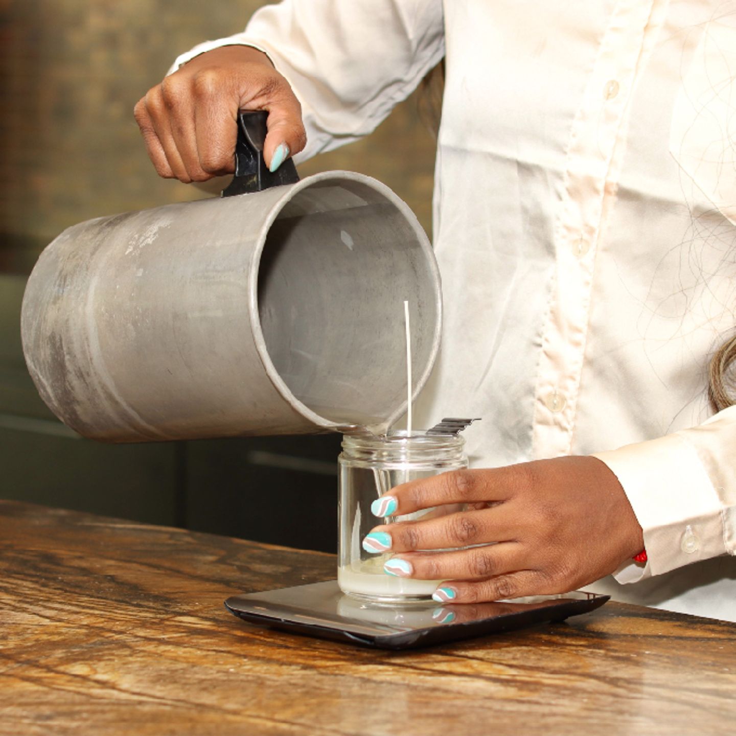 Women pouring candle