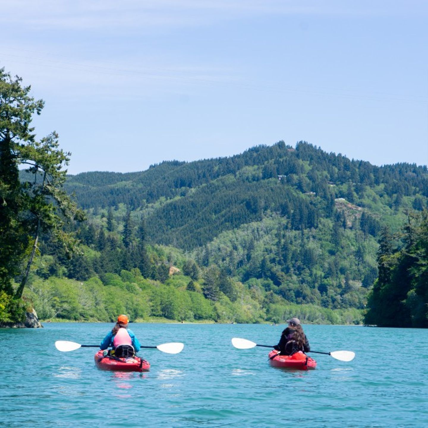 Two people kayaking with view