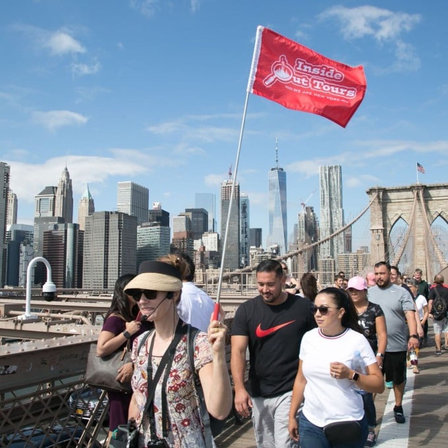 Guide and group walking on bridge
