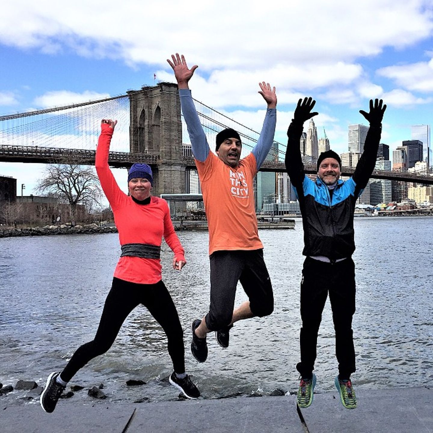 Three people jumping