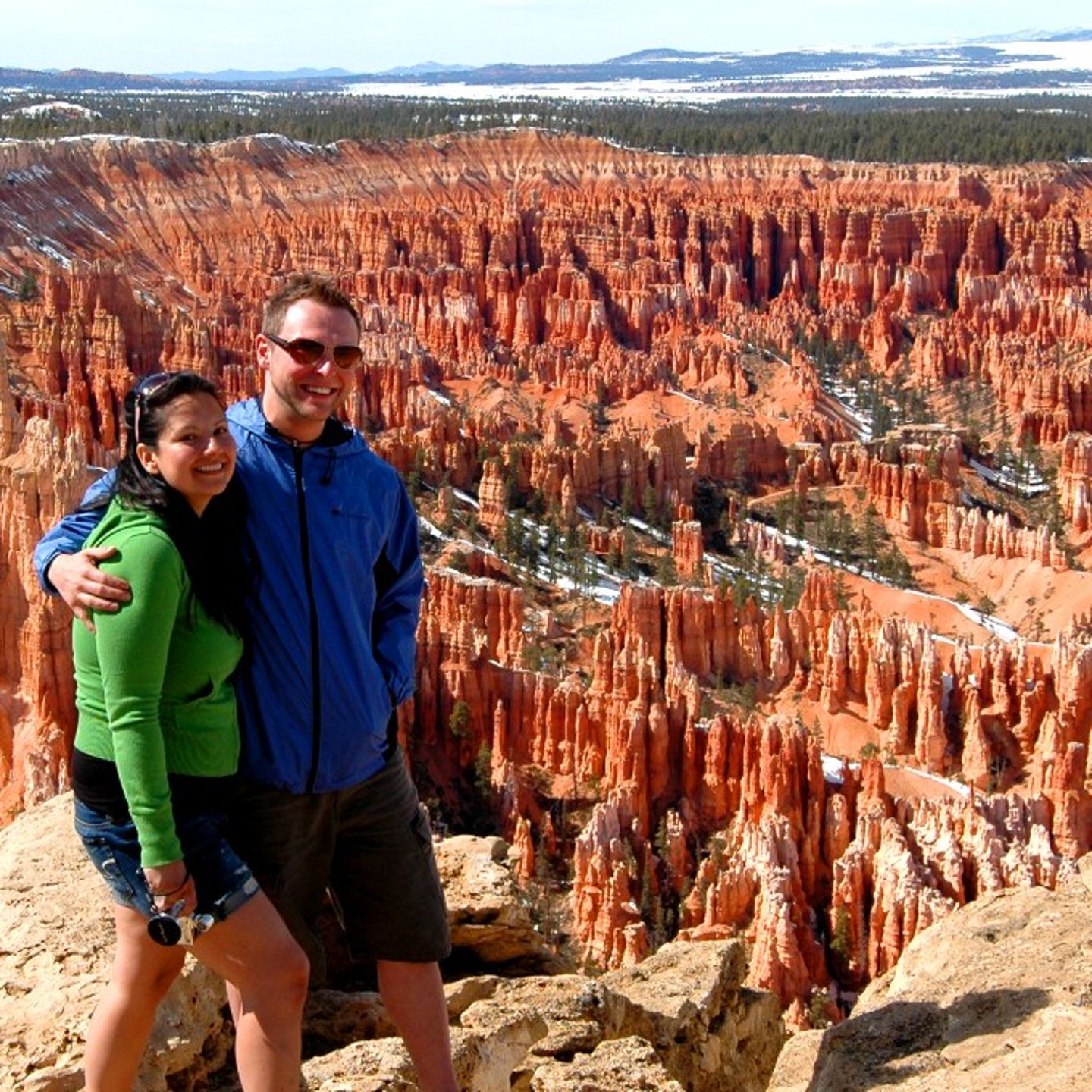 Two people posing in front of canyon