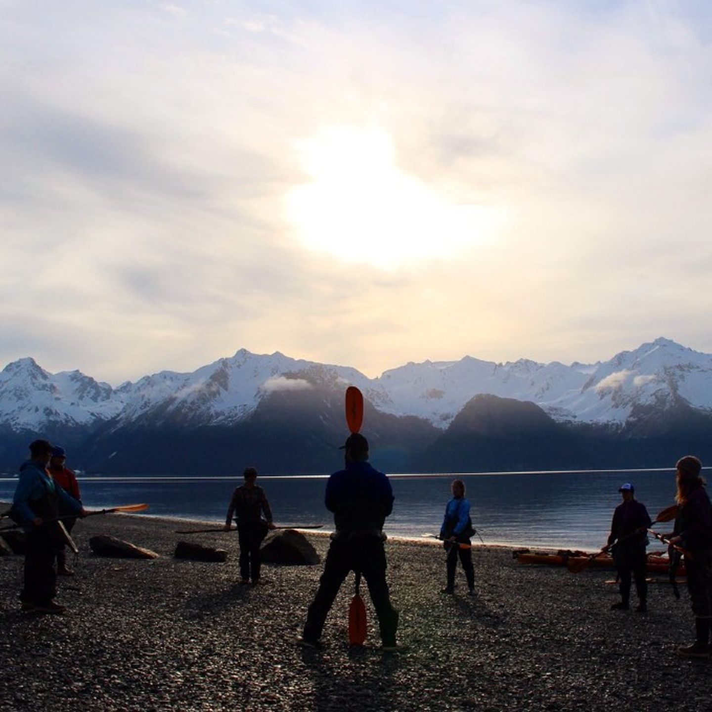 Group on Shore at Sunset