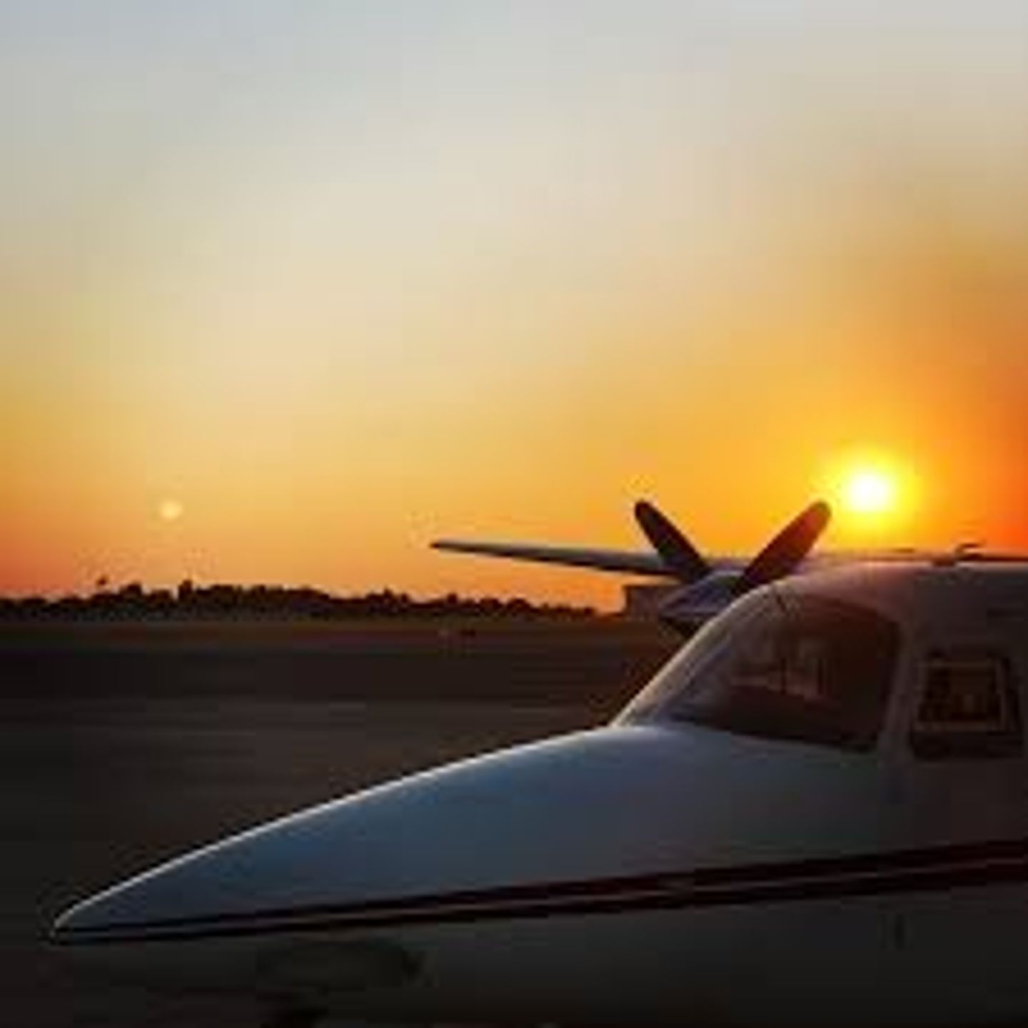 Plane on ground at sunset