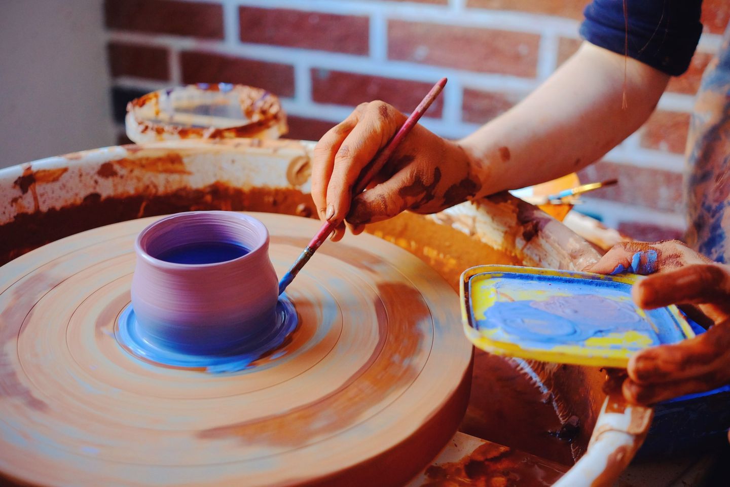 Painting on Pottery Wheel