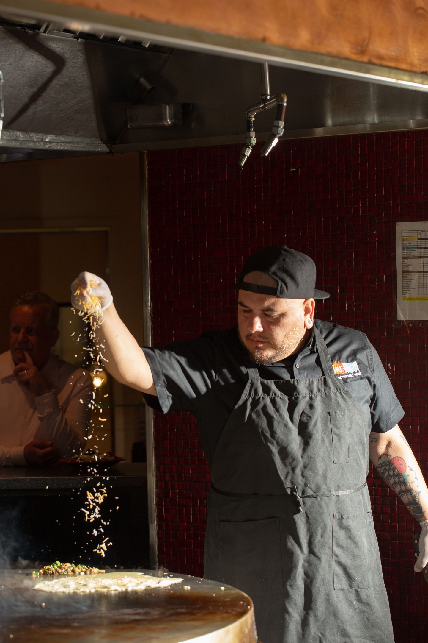 Chef sprinkling sugar