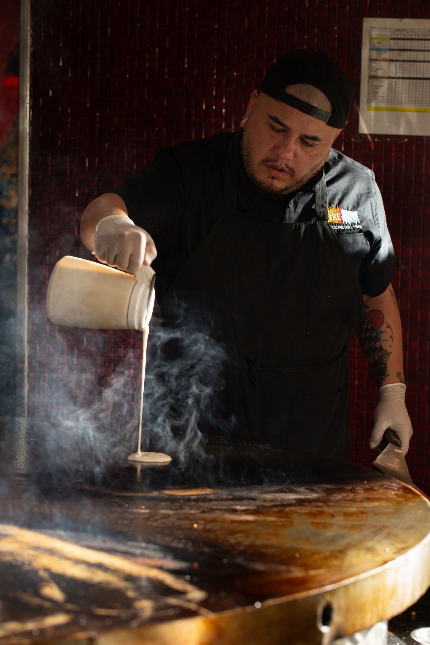Chef pouring batter