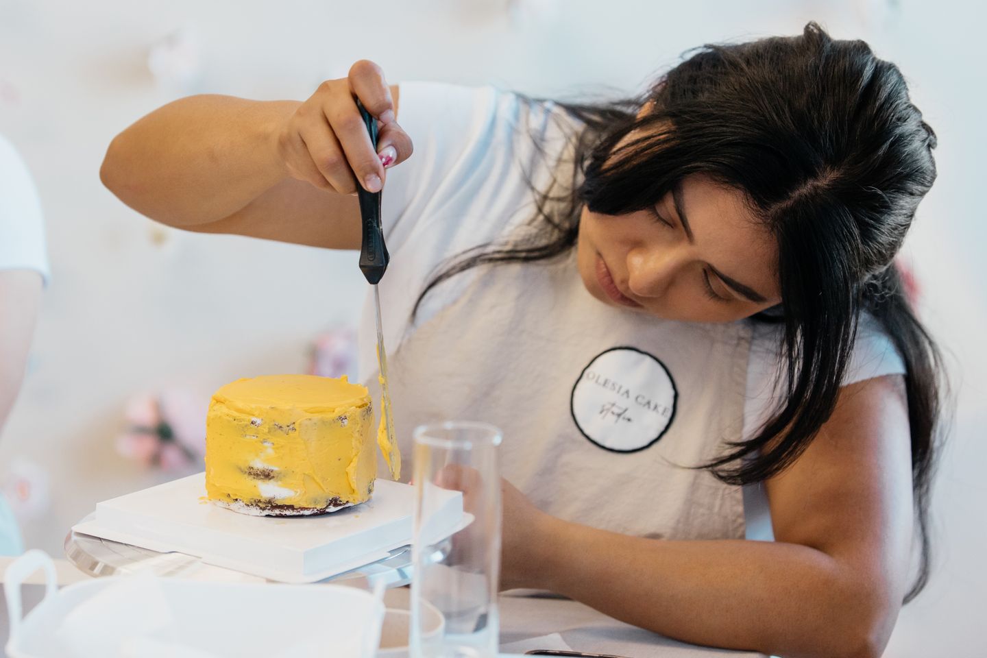 Woman frosting cake
