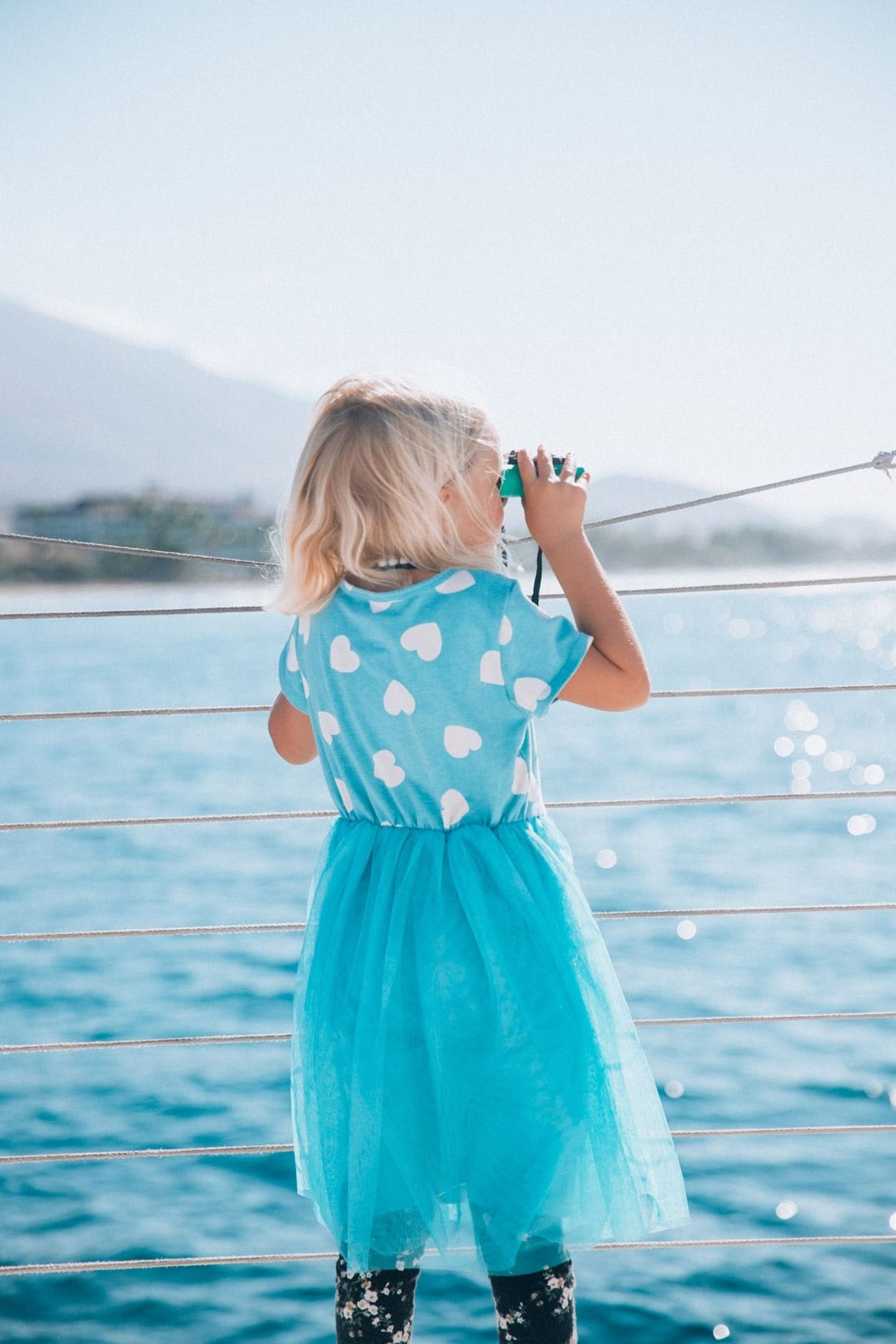 Little girl looking for whales