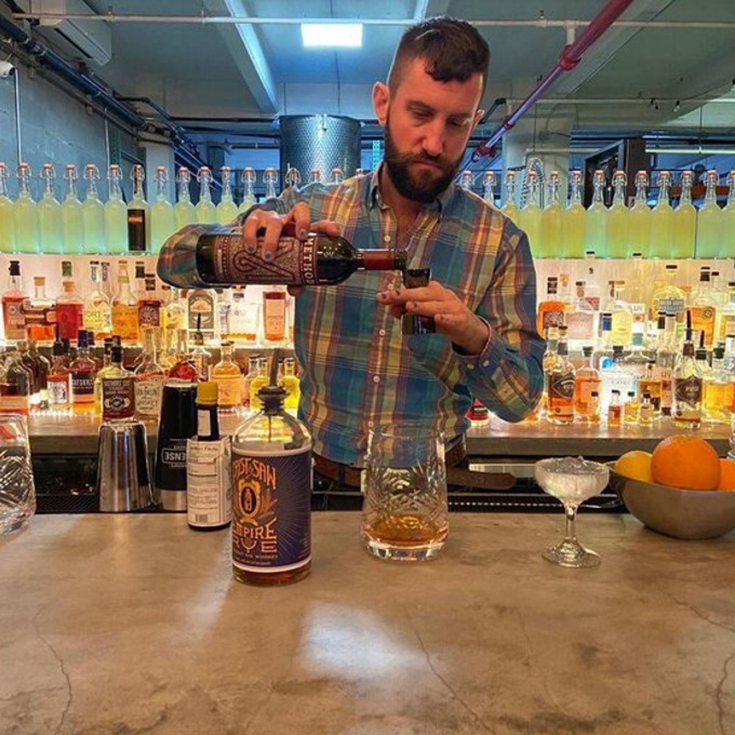 Person pouring liquor