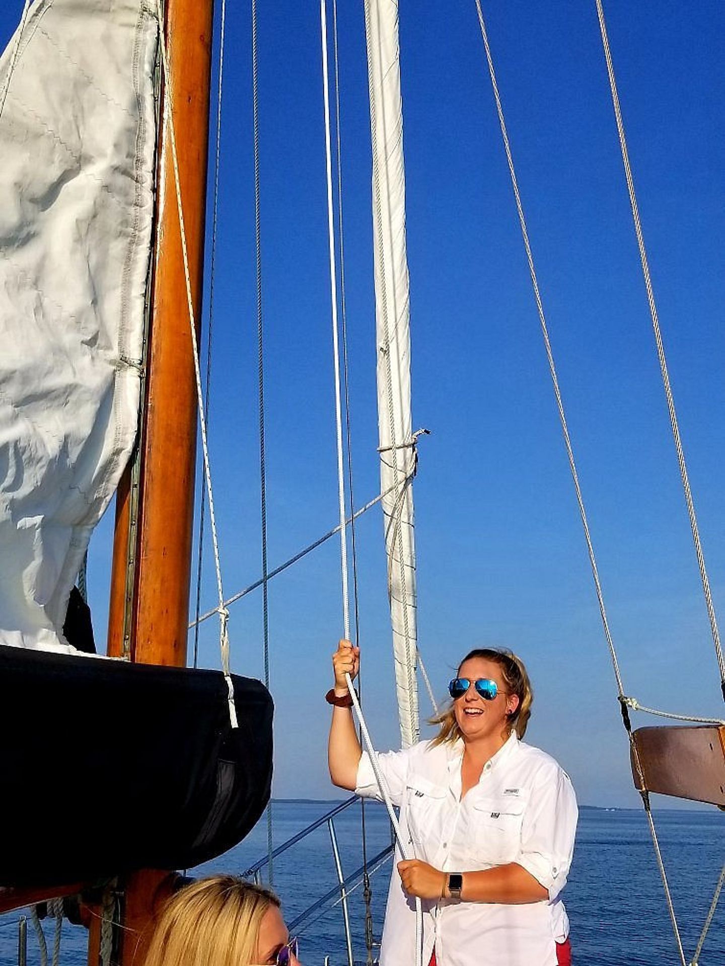 Woman Manning Sailboat