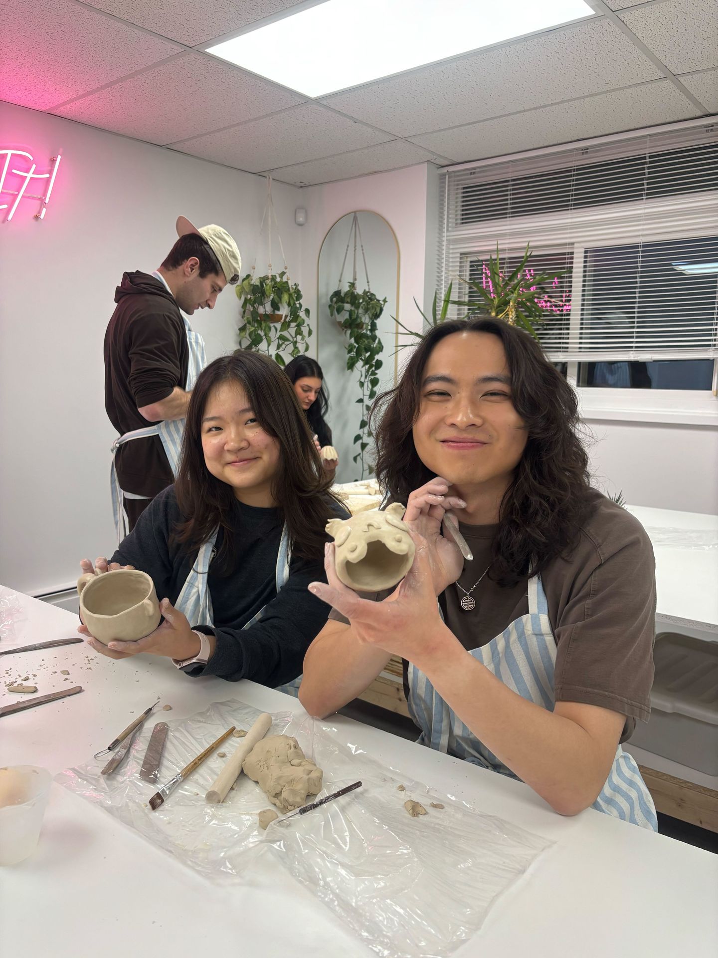 Couple making pottery
