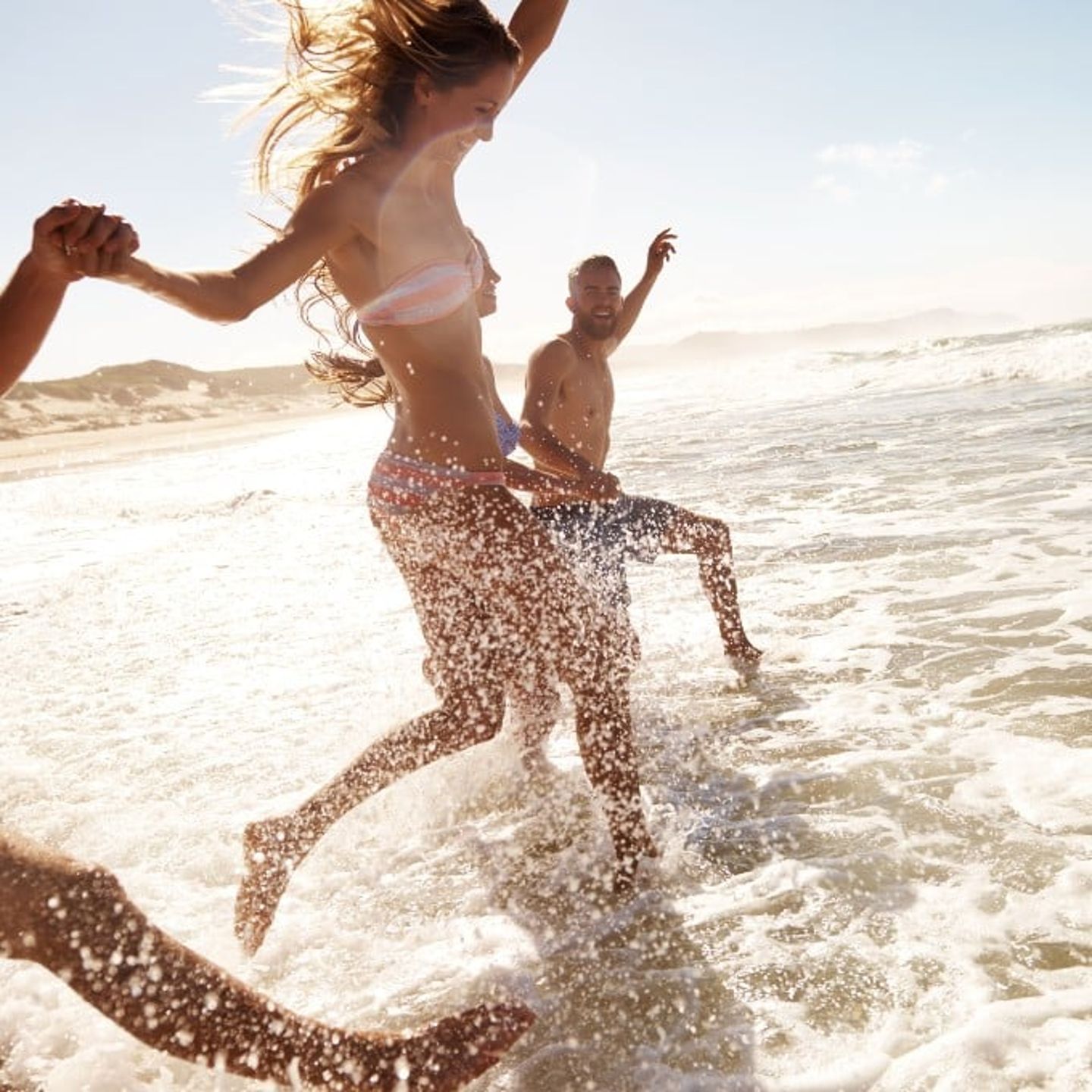 People running in water