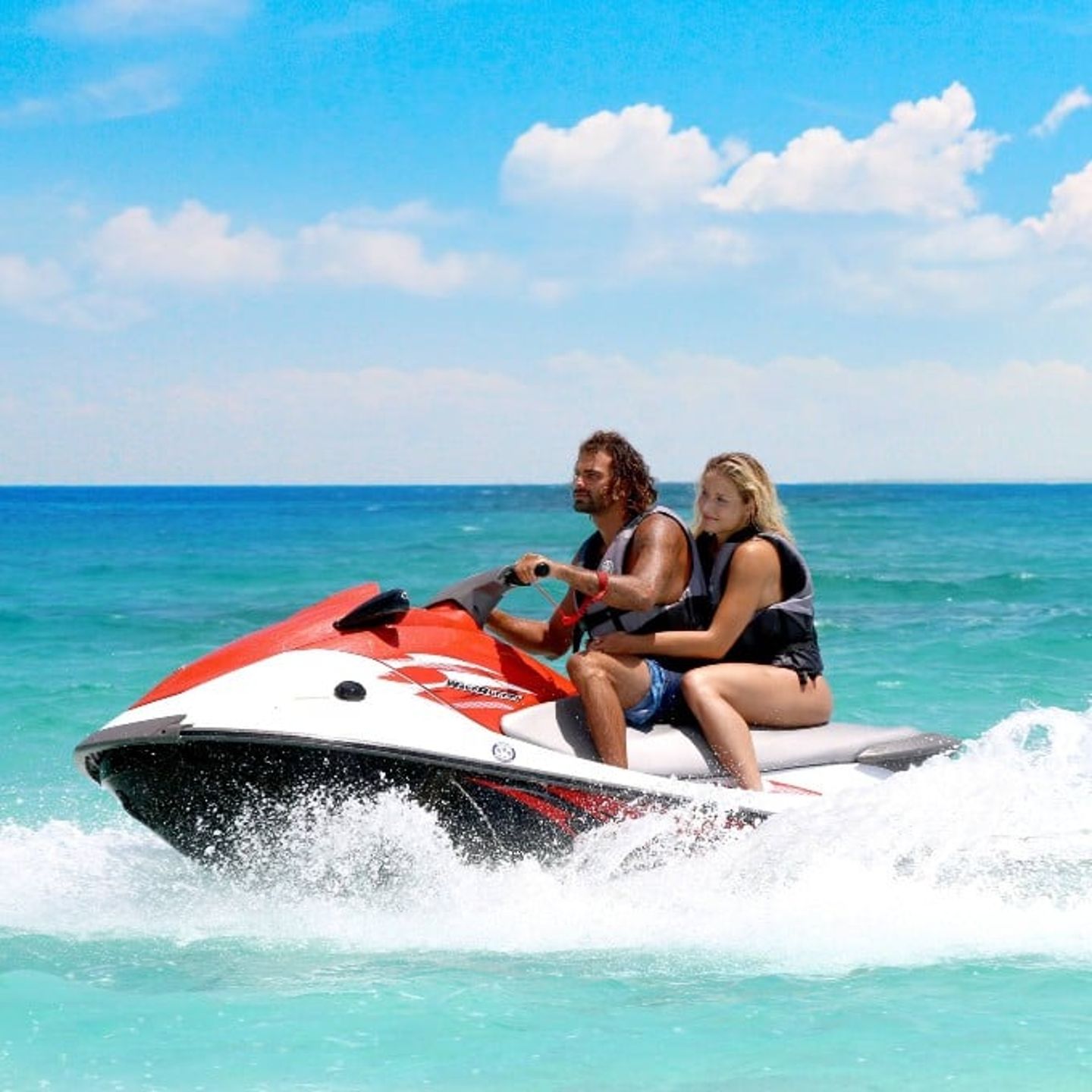 People jet skiing
