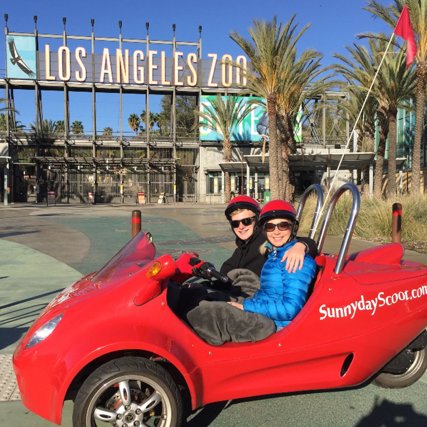 Car in front of zoo