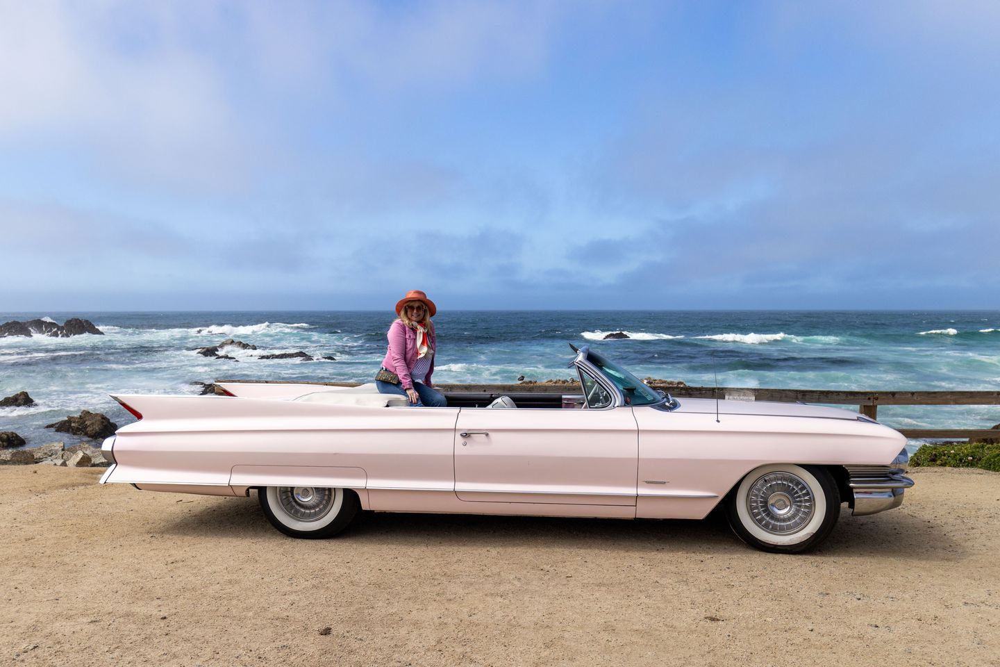 Woman in car at beach