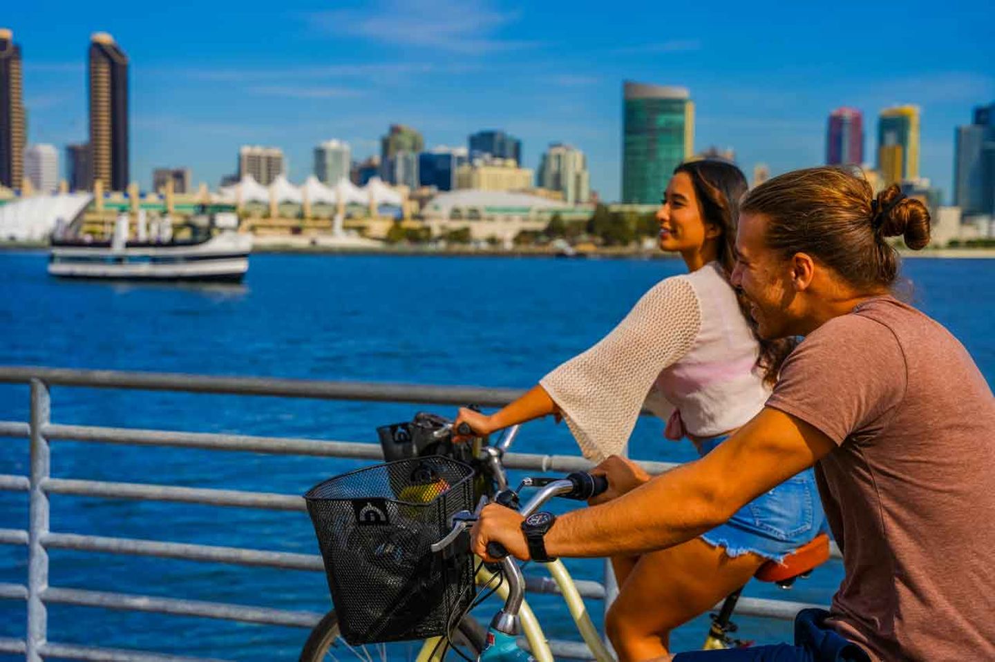 Two people riding bikes