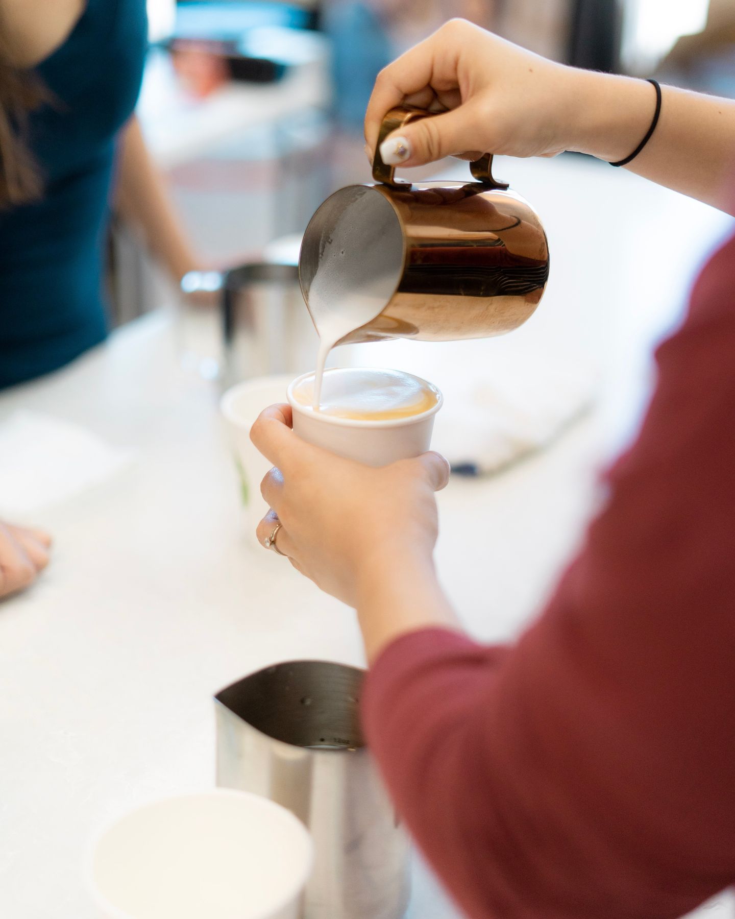 Person pouring milk