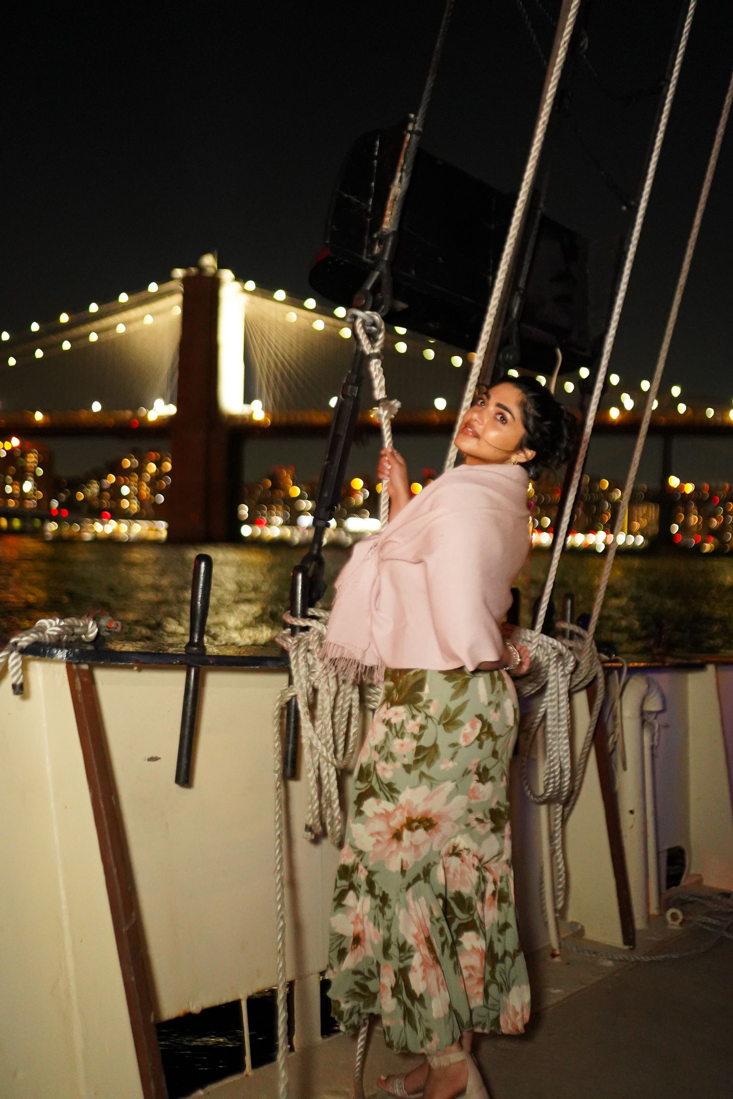Woman on boat with bridge