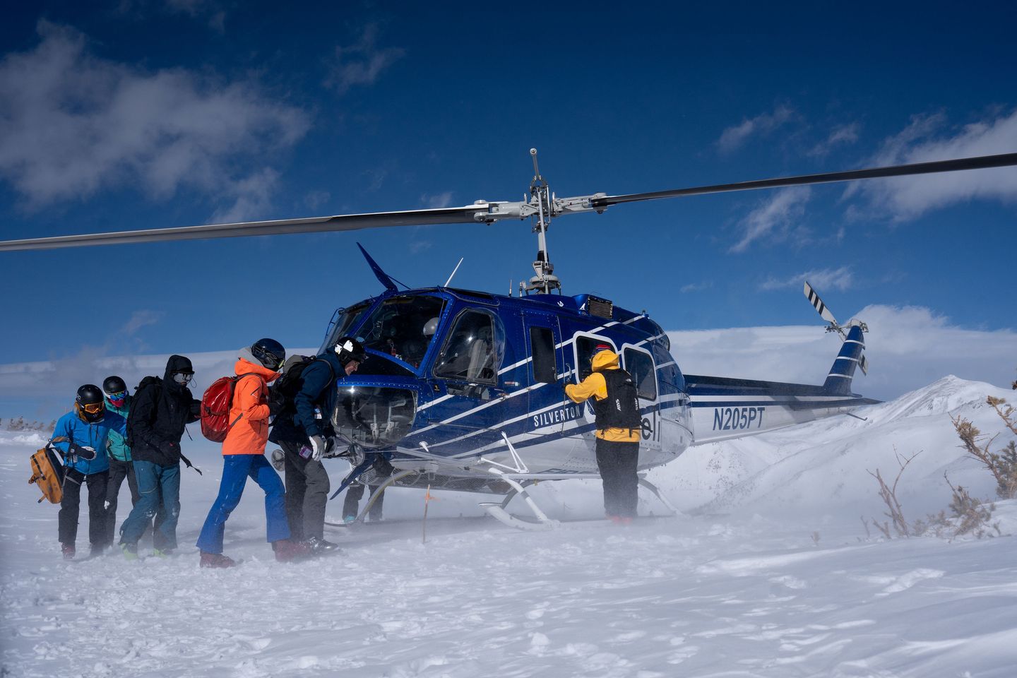 People getting in helicopter