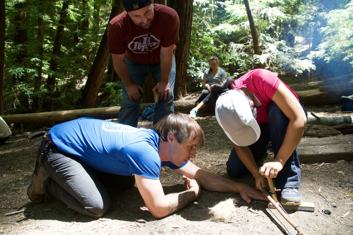 Two people starting fire