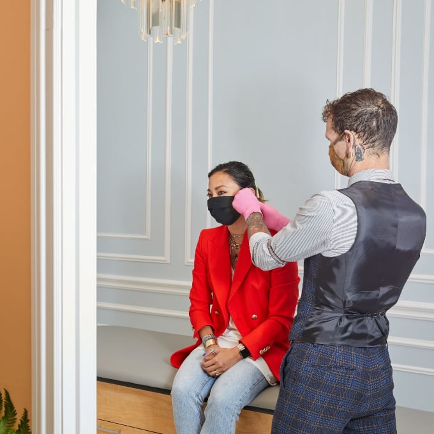 Woman getting ear pierced