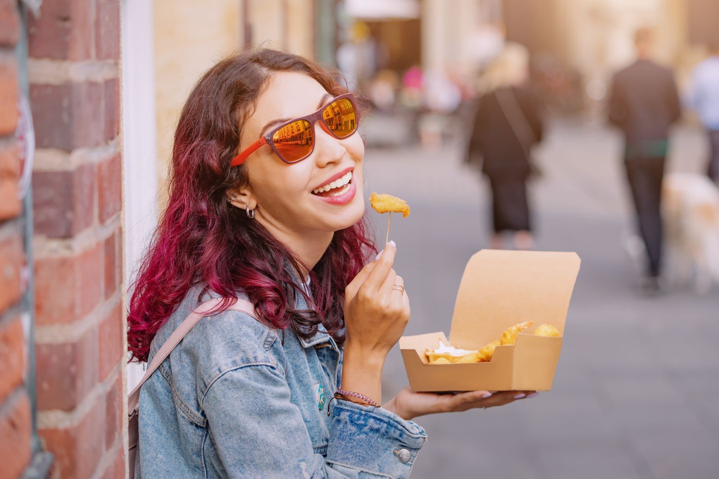 Woman enjoying street food